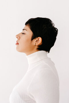 Calm Hispanic female with pixie cut
