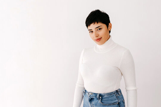 Hispanic woman in stylish clothes with pixie cut