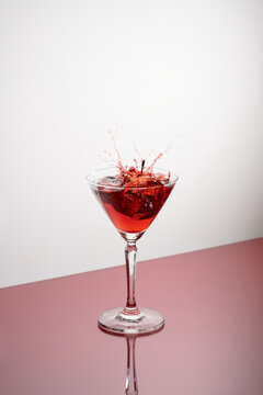 glasses of cherry brandy liqueur with ripe berries