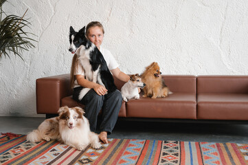 Woman with dogs sitting on couch