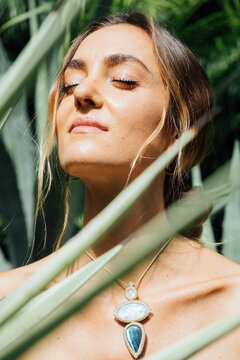 beautiful woman surrounded by agave plants