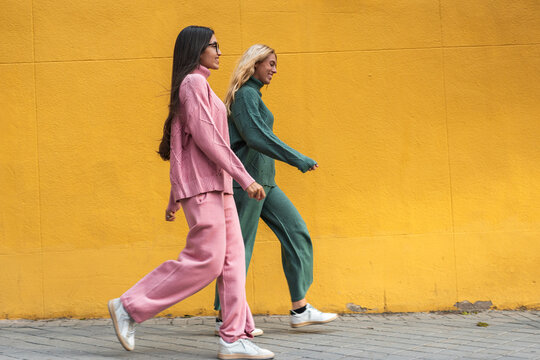 Women friends strolling the city