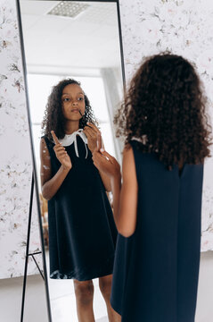 Teen Girl Doing Makeup In Studio