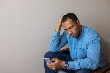 man read disturbing news on phone