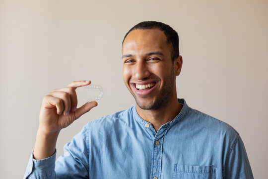 laughing man with aligner