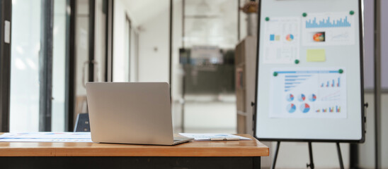Rear view of Laptop mockup on work desk. Office desk, business composition.