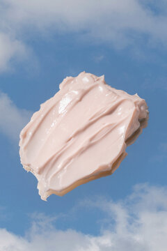 Fototapeta Pink Lotion Swatch on Cloud Background 