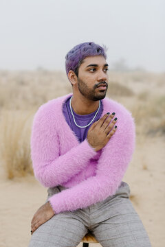 A melancholic man on the chair in the desert