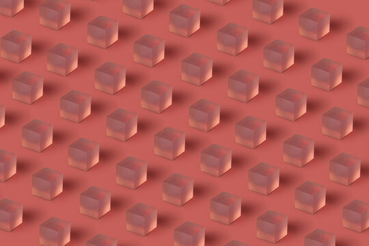 Translucent glass cubes repeated pattern on red.