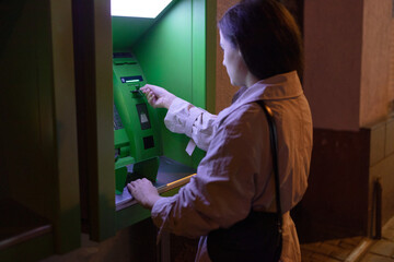 photo of a woman with an ATM