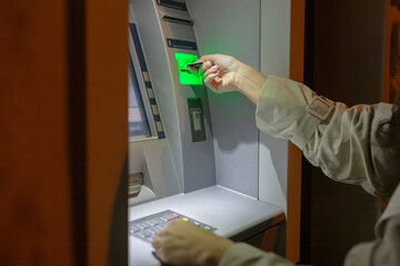 woman inserting a credit card