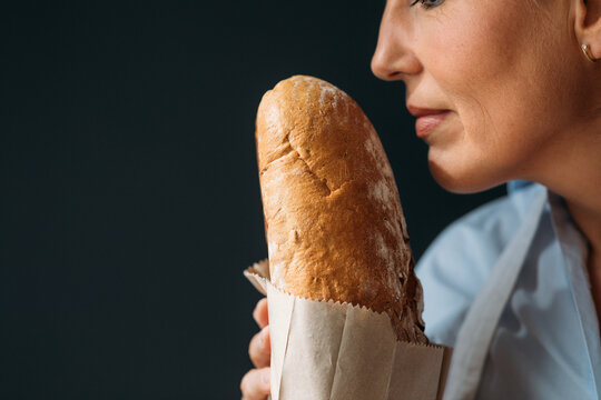 Woman Holding Bread
