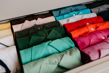 organization - Drawer with folded t-shirts organized by color