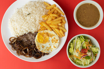 Meal - Steak with onions on horseback, rice, beans, salad and french fries