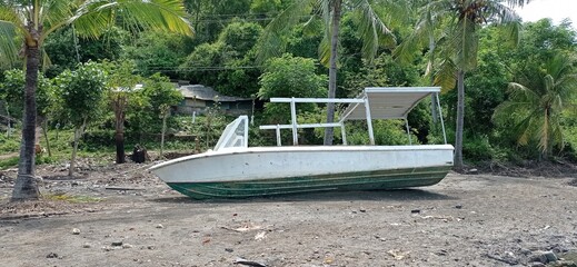 a shipwreck on the beach waiting to be repaired
