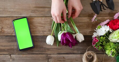 florist woman making bouquet at store