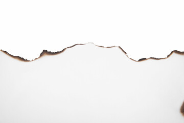 Piece of paper with dark burnt borders isolated on white, top view. Space for text