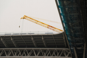 Building and improving the greatest football stadium with a crane in Spain, roof detail of the construction site. Santiago Bernabeu - Real Madrid
