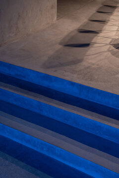 Glowing blue steps, performance stage design, empty fashion podium