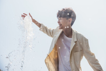 Man having fun with fountain