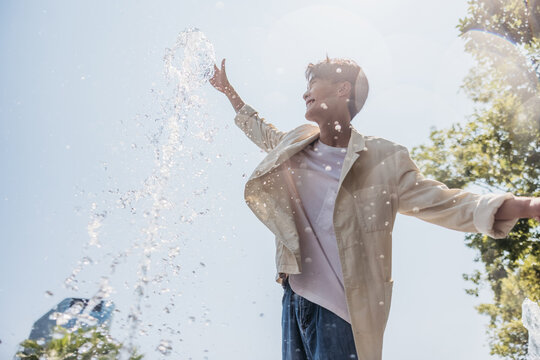 Man having fun with fountain