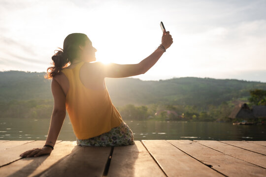 Travel Woman Taking A Selfie At Sunset