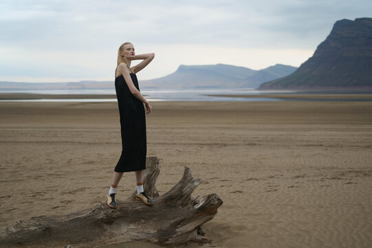 Portrait of a young tall woman on the nature background.
