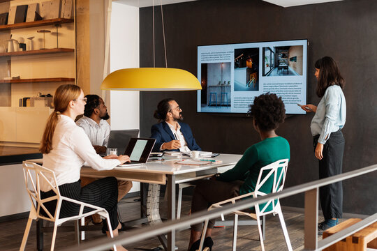 Diverse Group Of People Watching Presentation In The Office