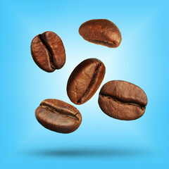 Many roasted coffee beans falling on light blue background