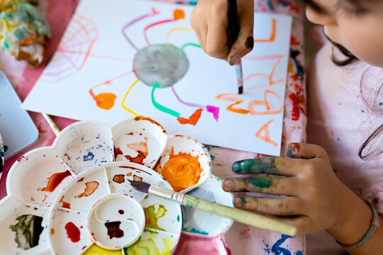 Little Girl Painting With Watercolor