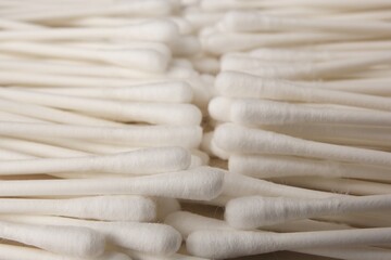 Many clean cotton buds as background, closeup