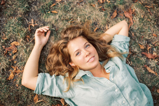 redhead woman in a park
