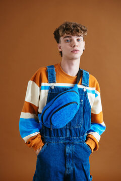 Stylish young man with hands in pockets