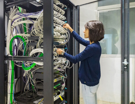 Engineer woman working in a datacenter 