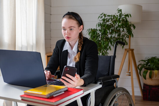 concentrated bisuness woman with disability using technology