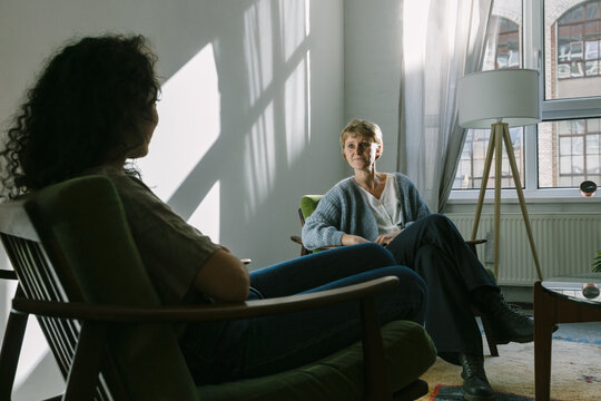 White Female Counselor In Session With Unrecognizable Woman