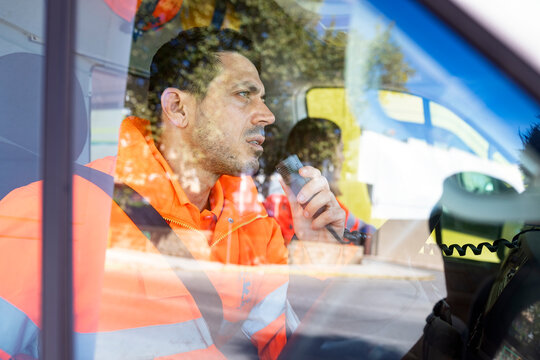 EMs Paramedic with Radio in Ambulance