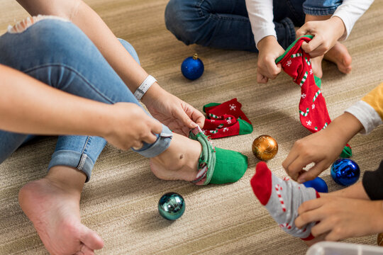 Family putting socks on their feet