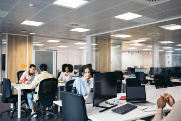 Group of business people working with laptop in a coworking