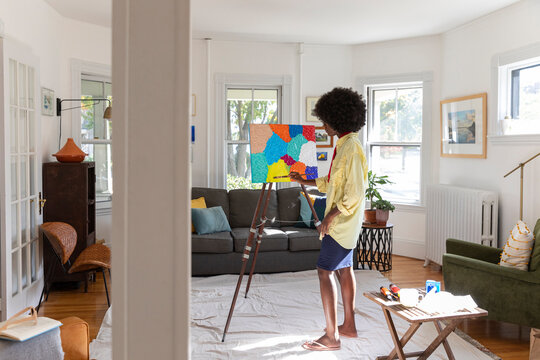 Black Lifestyle Girl artist Painting easel in house studio