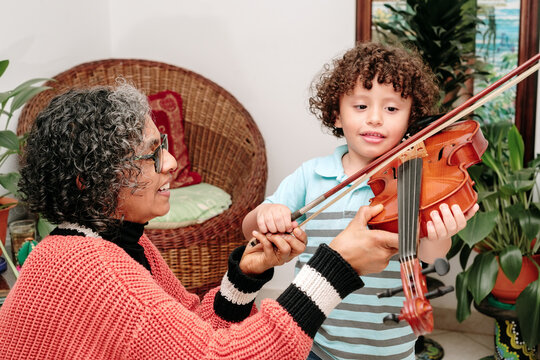 Music teacher teaching a child