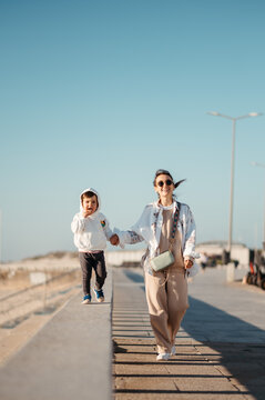 Mother stroll with son.