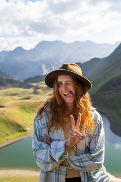 Funny Woman in the mountain looking at camera