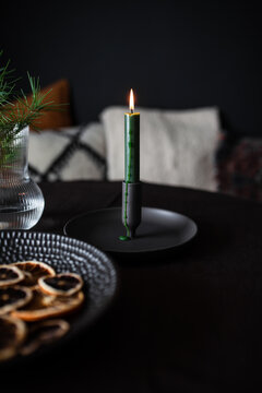 Single Candle Burning On Table