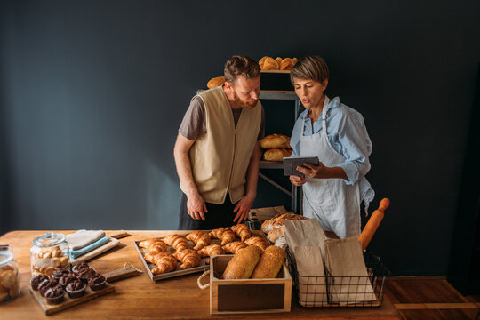 Naklejki Man and Woman in Bakery 