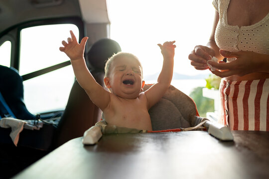 Crying and Expressive Baby in a Camper