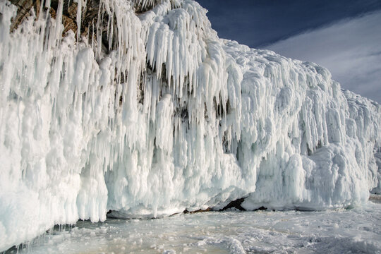 Frozen lake scenery with icicles