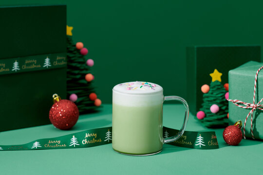 Cup of hot matcha and various attributes of holiday