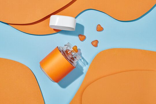 jelly candy or multivitamins closeup on the table on blue background