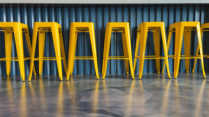 Row of yellow bar stools low angle at bar